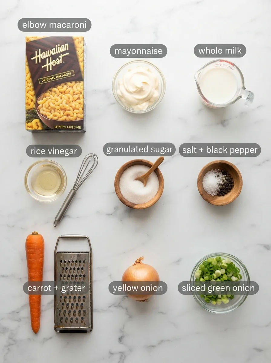 Ingredients for hawaiian bros pasta salad measured into bowls on marble