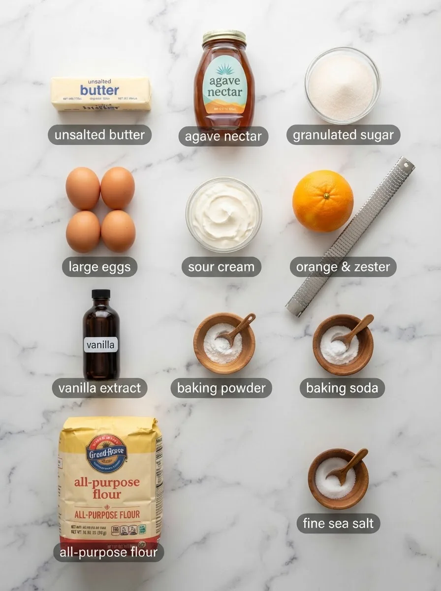 Ingredients for sol agave butter cake recipe in bowls: butter, agave, flour, eggs, orange