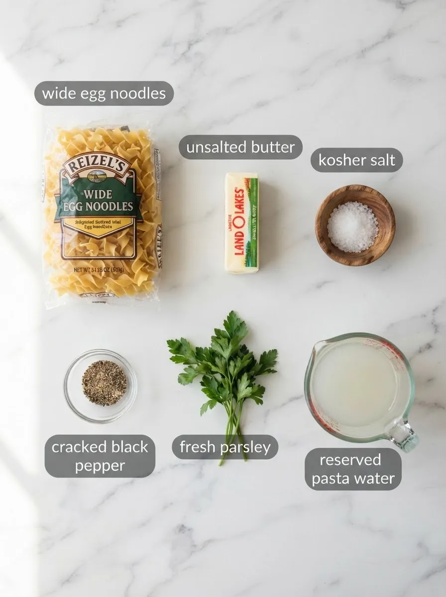 Ingredients for zehnder's buttered noodles measured on marble: noodles, butter, salt
